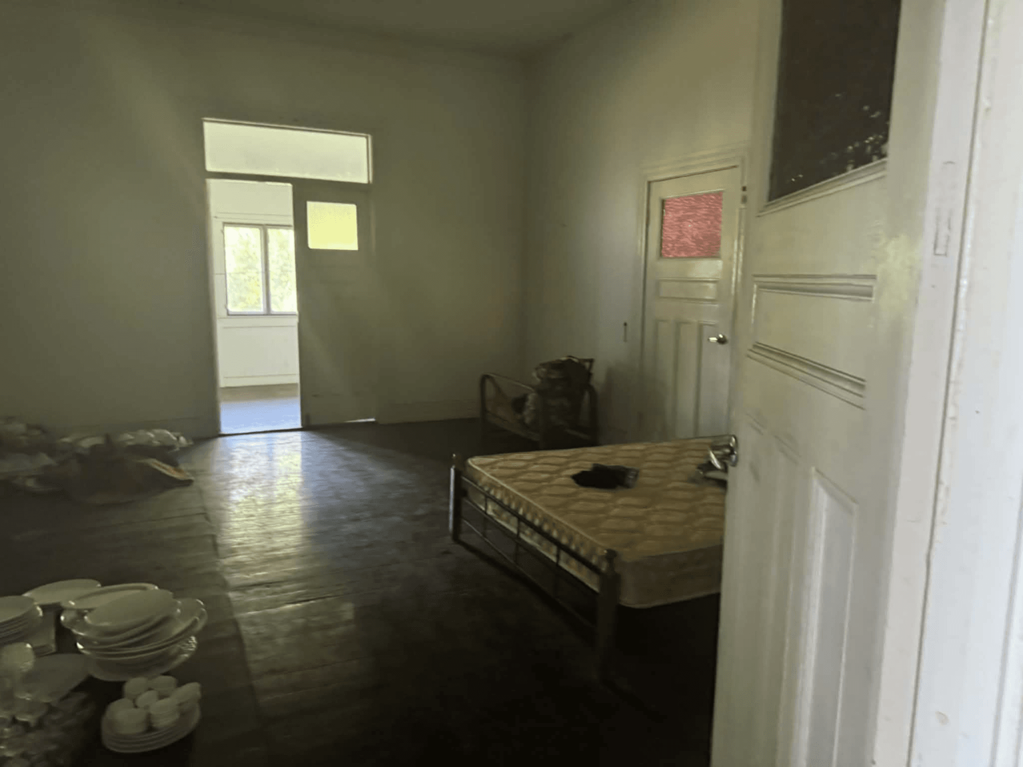 One of the bedrooms — in need of renovation to restore its original character